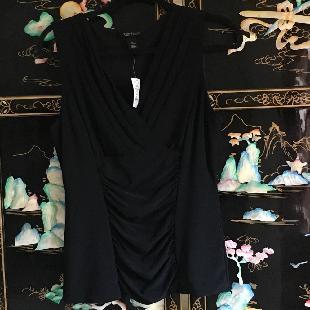 Sleeveless black ruched top.